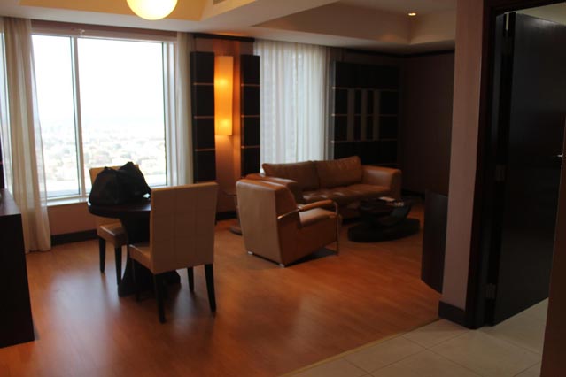 Emirates Grand Hotel Dubai UAE Review – wooden floor with brown leather couches