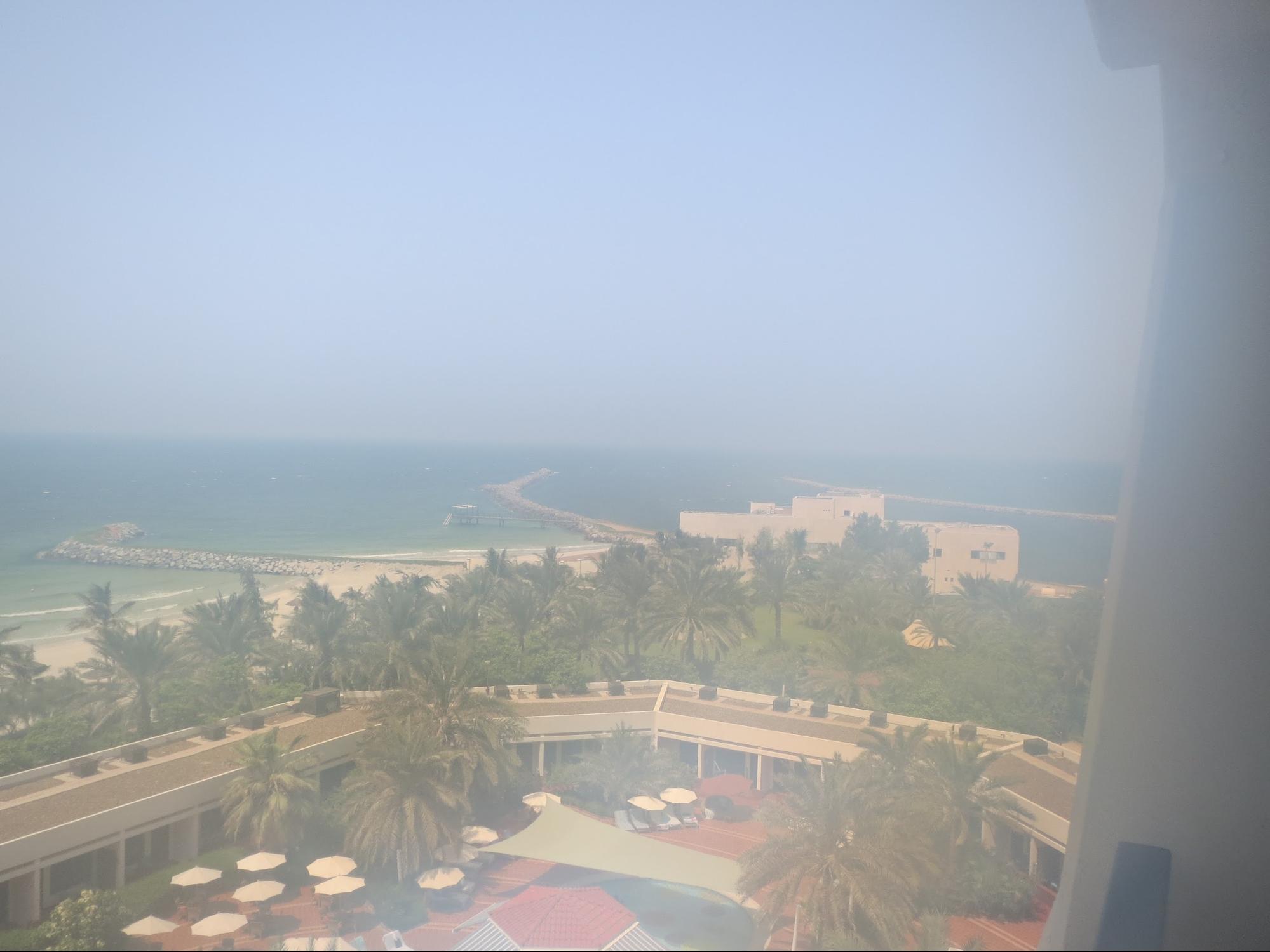 Kempinski Hotel, Ajman Review - Balcony Outside View - palm gardens, pool & beach